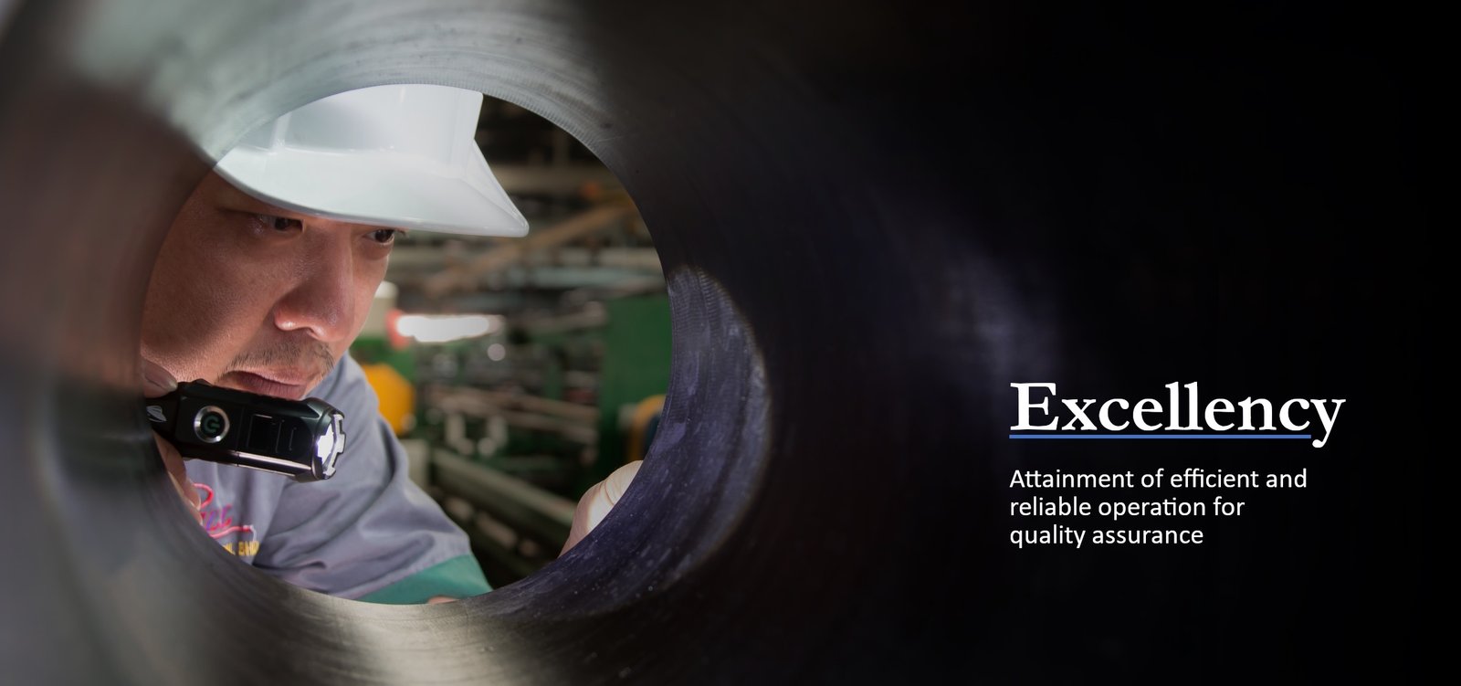 Wellcall technician inspecting the bore of an industrial hose — Excellency: efficient and reliable operation for quality assurance.